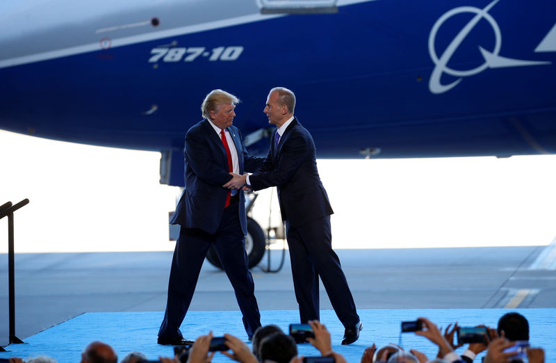 © Reuters. U.S. President Trump is greeted by Boeing CEO Dennis Muilenburg before his speech in front of a Boeing Dreamliner 787-10 at the Boeing South Carolina facility in North Charleston