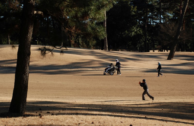 © Reuters. People play golf at Kasumigaseki Country Club in Kawagoe