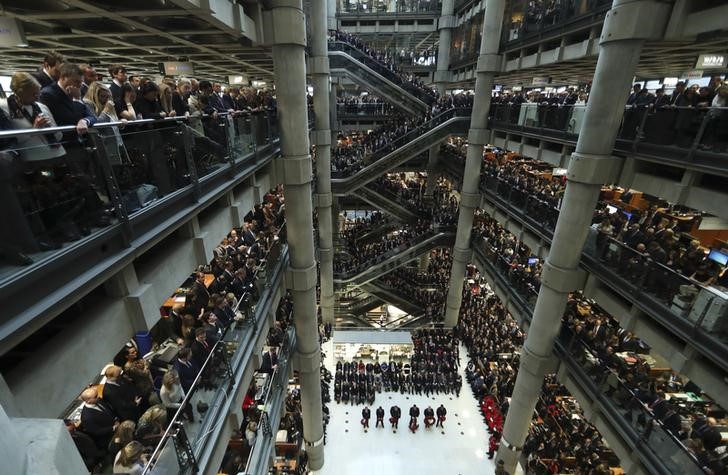 © Reuters. Lloyd's of London staff hold their annual Armistice Day service at the Lloyd's building in the City of London