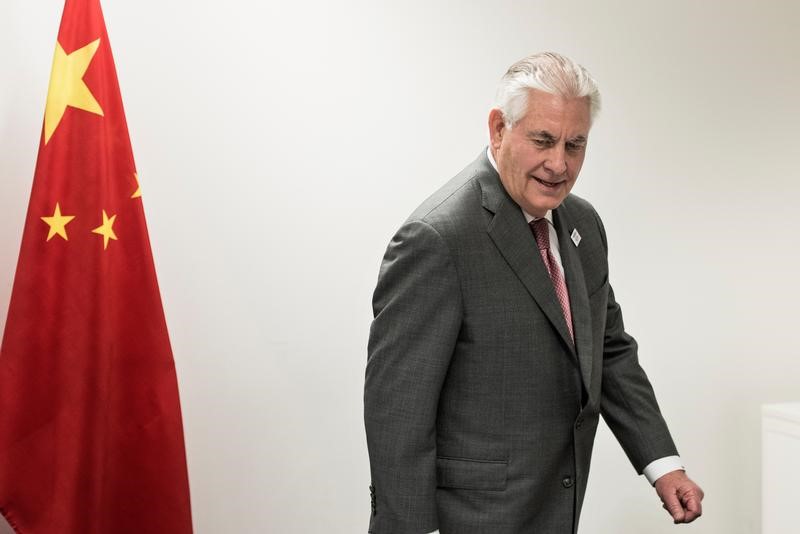 © Reuters. US Secretary of State Tillerson takes his seat for a meeting with China's Foreign Minister Wang on the sidelines of a gathering of Foreign Ministers of the G20 leading and developing economies at the World Conference Center in Bonn