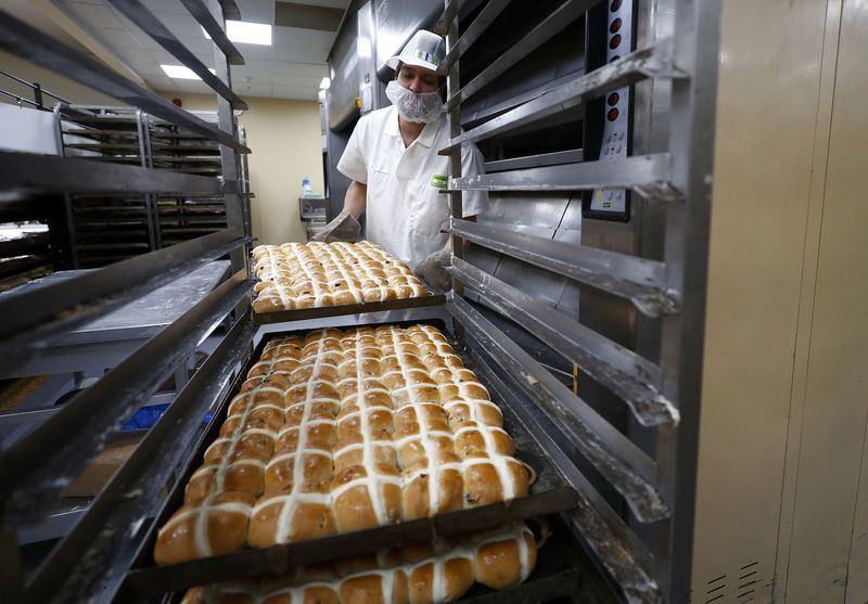 © Reuters. An employee works in the bakery at the Asda superstore in High Wycombe