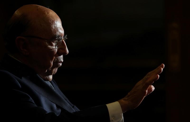 © Reuters. Meirelles attends an interview in Brasilia