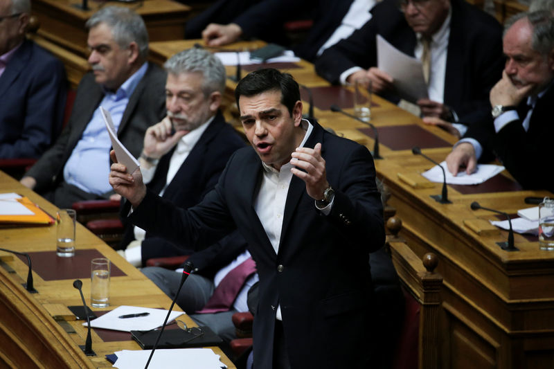 © Reuters. Greek PM Tsipras answers a question on the results of the latest Eurogroup during the Prime Minister's Question Time at the parliament in Athens
