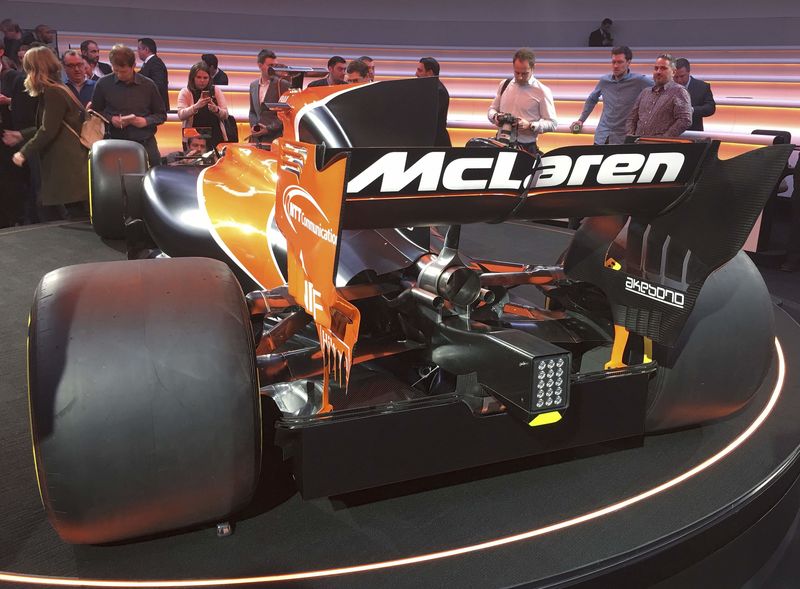 © Reuters. Journalists use their mobile phones to photograph McLaren's new MCL32 Formula One car at its launch in Woking