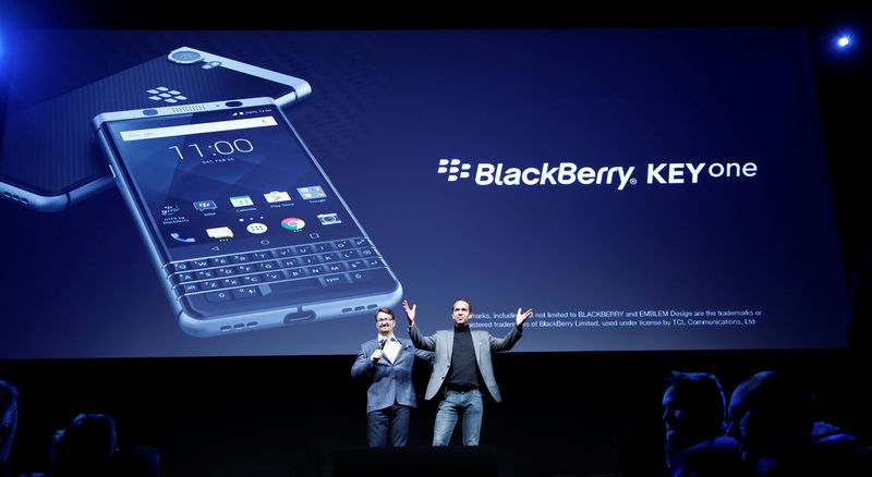 © Reuters. TCL Communication's CEO Nicolas Zibell and Kevin Michaluk present the new BlackBerry Key One before the Mobile World Congress in Barcelona