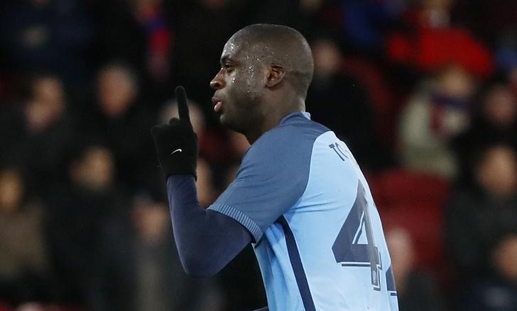 © Reuters. Manchester City's Yaya Toure celebrates scoring their third goal