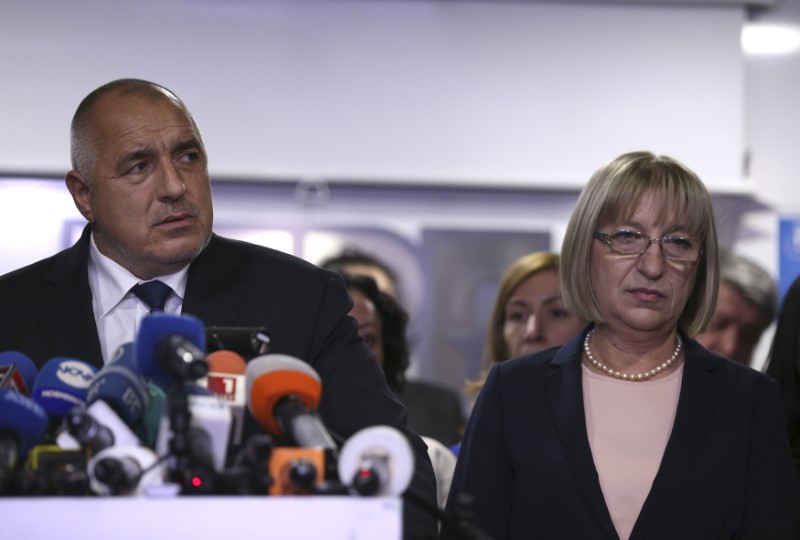 © Reuters. Presidential candidate for GERB party Tsacheva and Bulgaria's Prime Minister Borissov react to the result of the exit polls during presidential election in Sofia