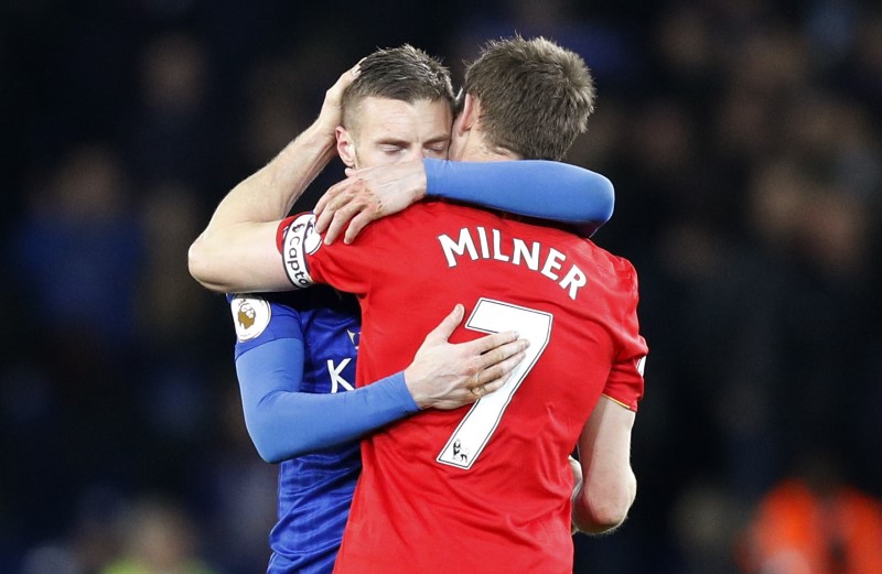 © Reuters. Leicester City's Jamie Vardy hugs Liverpool's James Milner after the game