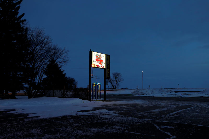 © Reuters. A lit sign for the Maple Leaf Motel is seen at dusk in Emerson