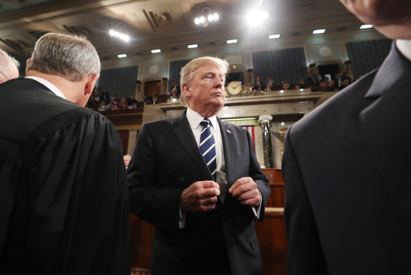 © Reuters. US President Trump departs after address to Joint Session of Congress in Washington