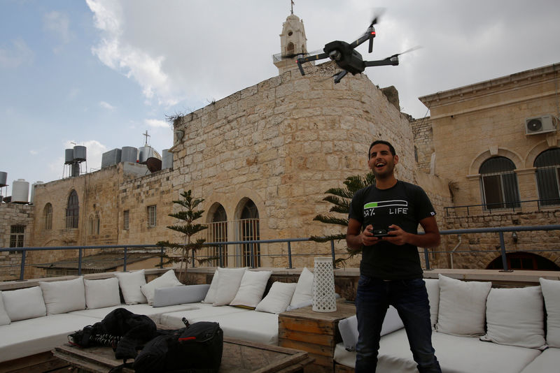 © Reuters. Nuseir Yassin flies his drone in the old city of the West Bank city of Bethlehem