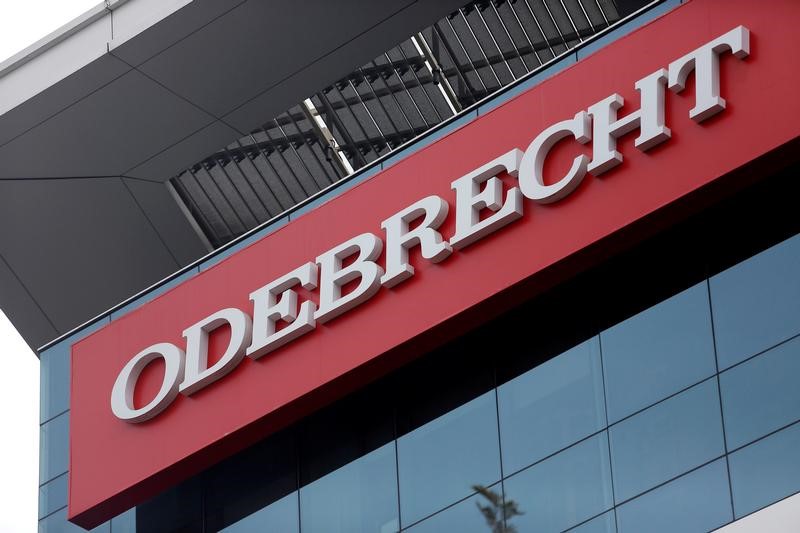 © Reuters. FILE PHOTO - A sign of the Odebrecht SA construction conglomerate is pictured in Lima