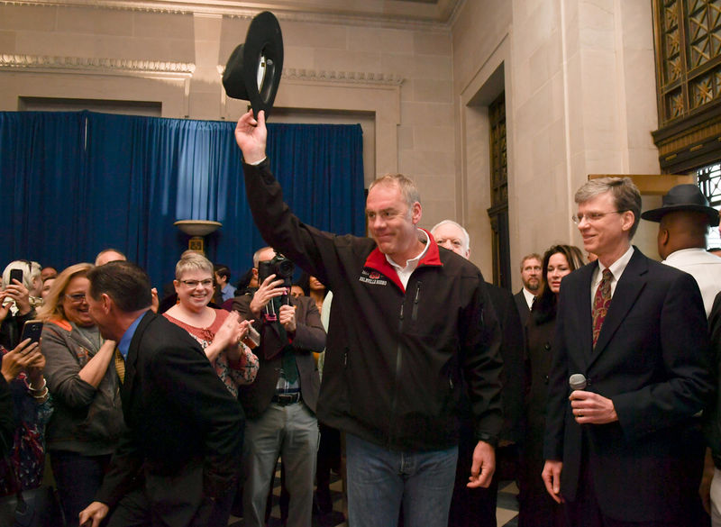 © Reuters. Handout photo new Interior Secretary Ryan Zinke tipping his cowboy hat after riding in on horseback with a U.S. Park Police  horse mounted unit reporting for his first day of work at the Interior Department in Washington