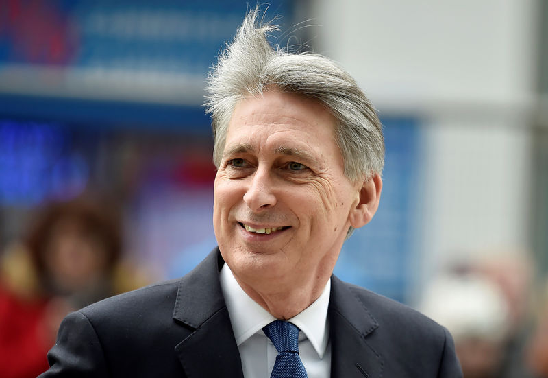 © Reuters. FILE PHOTO:Britain's Chancellor of the Exchequer Philip Hammond  arrives at the National Cyber Security Centre in London