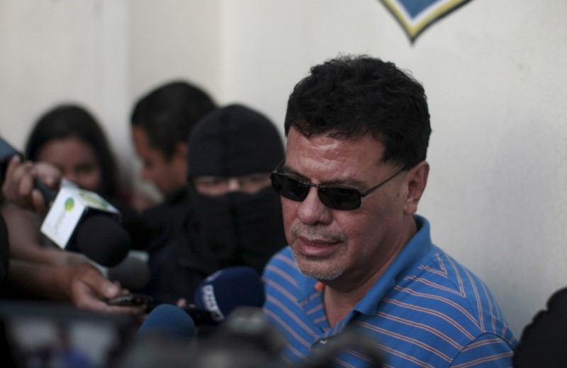 © Reuters. Former president of El Salvador's soccer federation Reynaldo Vazquez is presented to the media after his arrest in San Salvador, El Salvador