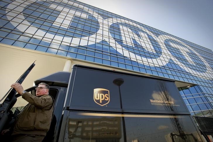 © Reuters. A courier van of UPS is seen in front of the head office of TNT in Hoofddorp