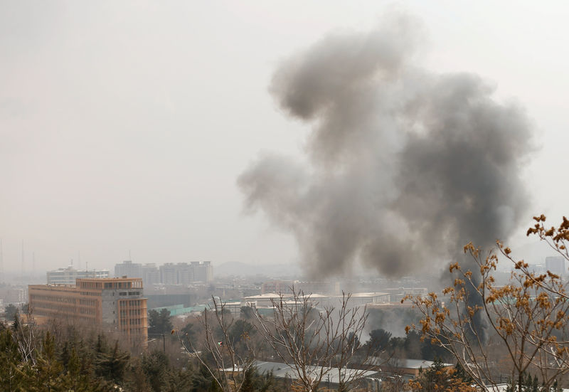 © Reuters. Smoke rises from a military hospital area at the site of blast and gunfire in Kabul