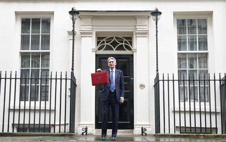 © Reuters. Britain's Chancellor of the Exchequer Philip Hammond stands outside 11 Downing Street before delivering his budget to the House of Commons in London