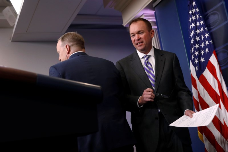 © Reuters. Mulvaney speaks with reporters after being introduced by Spicer during the daily press briefing at the White House in Washington