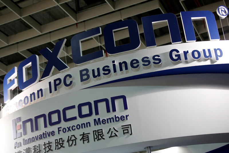 © Reuters. FILE PHOTO: Logos of Foxconn and Ennoconn are seen during the annual Computex computer exhibition in Taipei
