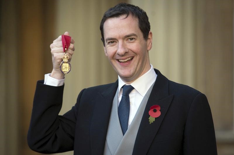 © Reuters. Former Chancellor George Osborne poses with the Order of the Companions of Honour which he received from the Duke of Cambridge at Buckingham Palace in London