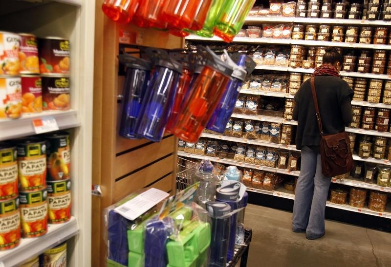 © Reuters. A woman shops for groceries at a Whole Foods supermarket in New York