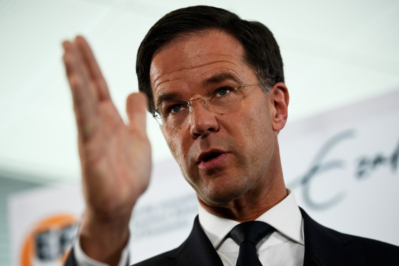 © Reuters. Dutch Prime Minister Mark Rutte of the VVD Liberal party attends a news conference during campaigning for the Dutch elections in Rotterdam