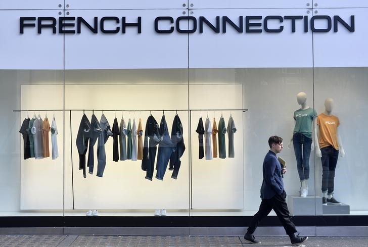 © Reuters. A person walks past a French Connection store in London, Britain