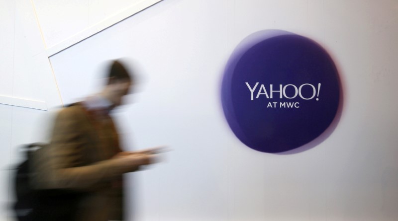 © Reuters. File photo of a man walking past a Yahoo logo during the Mobile World Congress in Barcelona