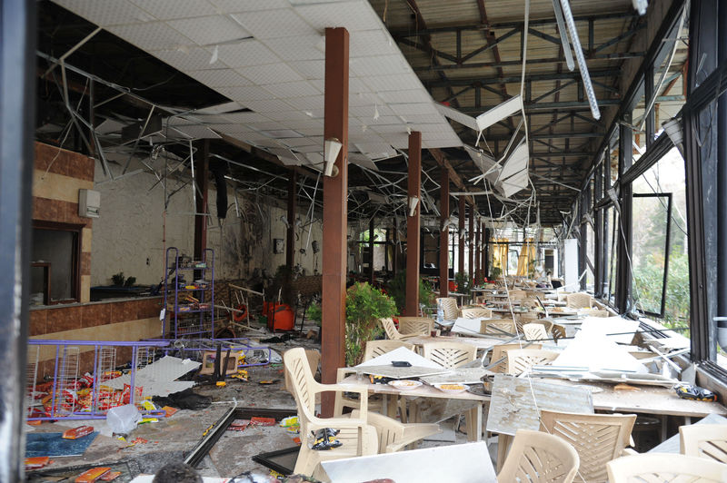 © Reuters. Damage is seen after a suicide attack inside a restaurant in the al-Rabweh area of Damascus