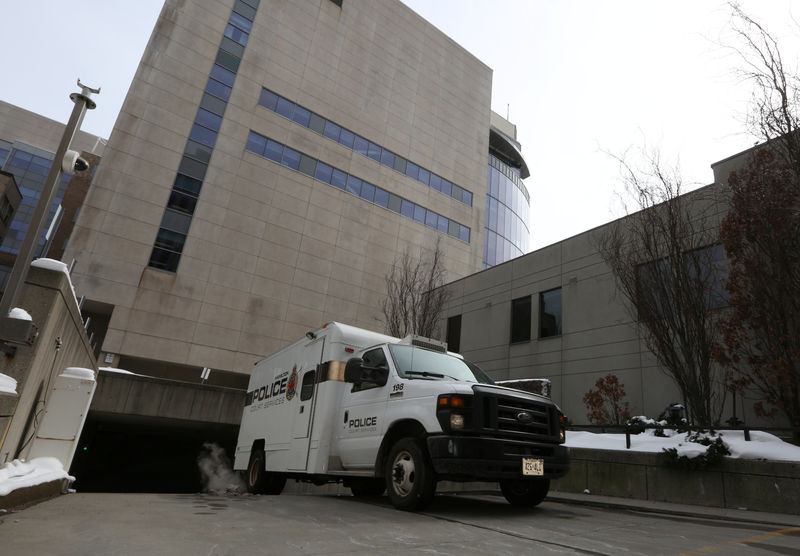 © Reuters. A police transport vehicle leaves the John Sopinka Courthouse, where Karim Baratov appeared in front of a judge in Hamilton