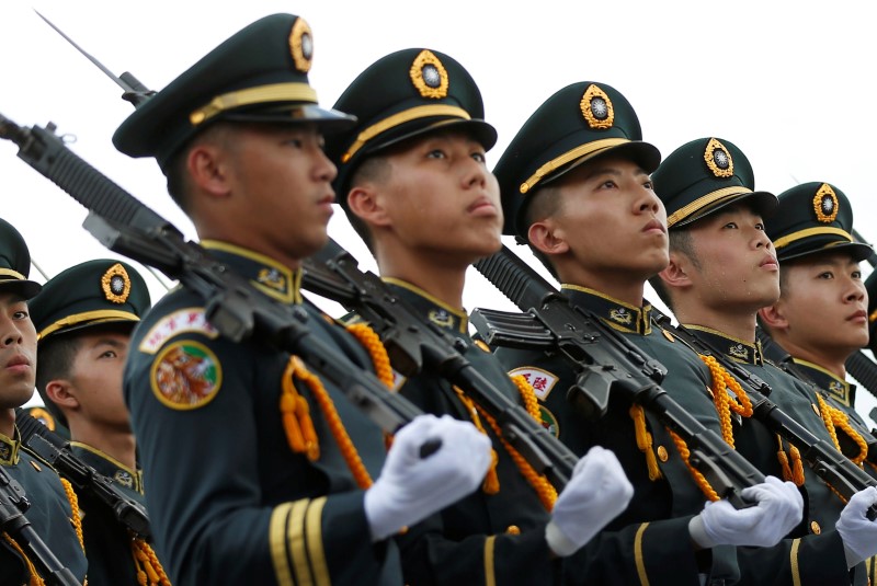 © Reuters. Taiwanese cadets march during a ceremony to mark the 92nd anniversary of the Whampoa Military Academy, in Kaohsiung, southern Taiwan