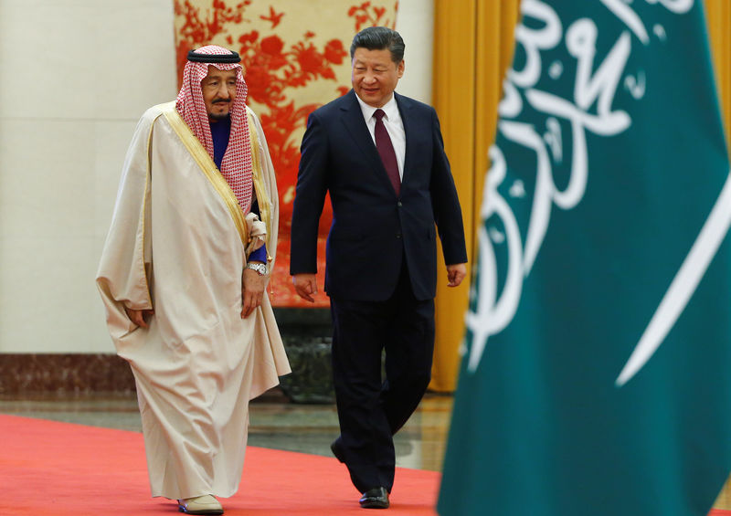 © Reuters. China's President Xi Jinping and Saudi King Salman bin Abdulaziz Al-Saud arrive for a welcoming ceremony at the Great Hall of the People in Beijing