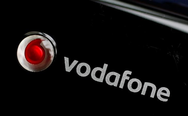 © Reuters. FILE PHOTO:  A Vodafone logo is seen on a mobile internet dongle in this photo illustration