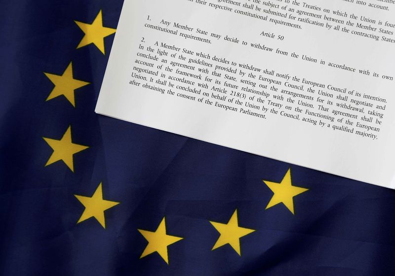 © Reuters. FILE PHOTO - Article 50 of the EU's Lisbon Treaty is pictured with an EU flag following Britain's referendum results to leave the European Union, in this photo illustration taken in Brussels