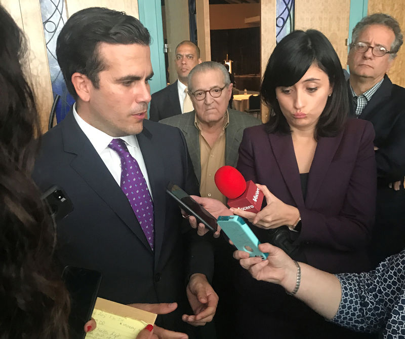 © Reuters. Governor Ricardo Rossello talks with reporters after a speech in San Juan