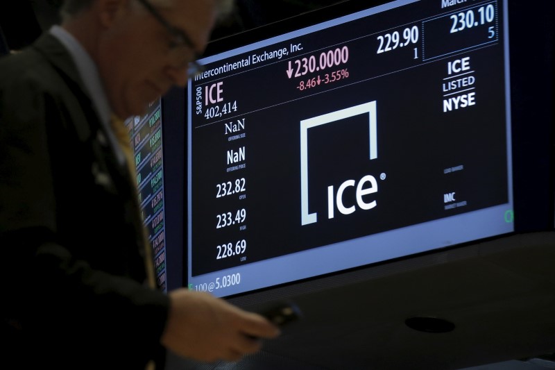 © Reuters. A trader passes by a screen displaying the trading info for Intercontinental Exchange Inc. (ICE) on the floor of the New York Stock Exchange