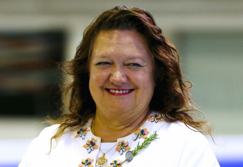 © Reuters. Australian mining heiress and Chairman of Hancock Prospecting group Gina Rinehart prepares to award medals to competitors at Australian Synchronised Swimming Championships in Sydney