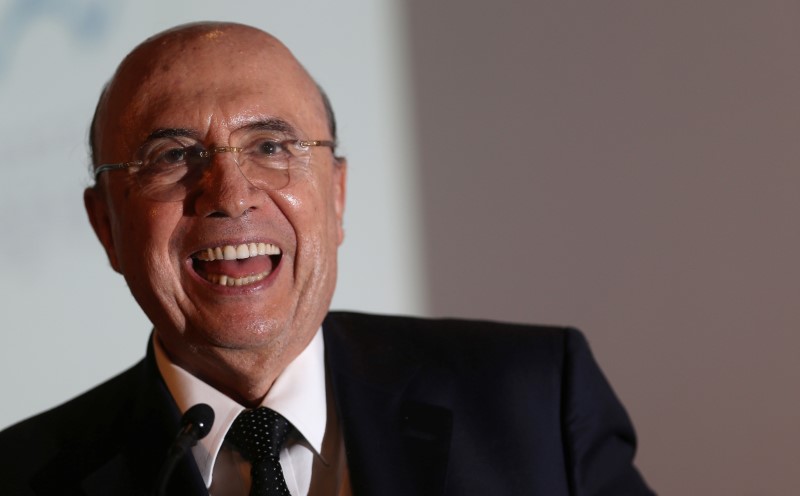 © Reuters. Brazil's Finance Minister Meirelles smiles at the Latin American Cities Conference in Brasilia