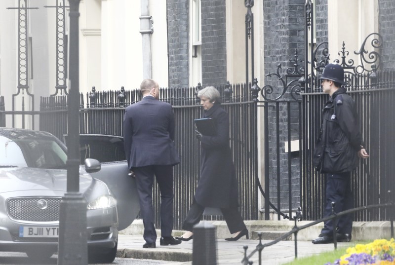 © Reuters. Britain's Prime Minister Theresa May leaves 10 Downing Street the morning after an attack by a man driving a car and weilding a knife left five people dead and dozens injured, in London