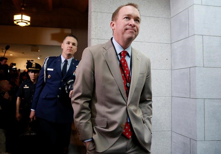 © Reuters. Mulvaney arrives with Trump to meet with congressional Republicans at the U.S. Capitol in Washington