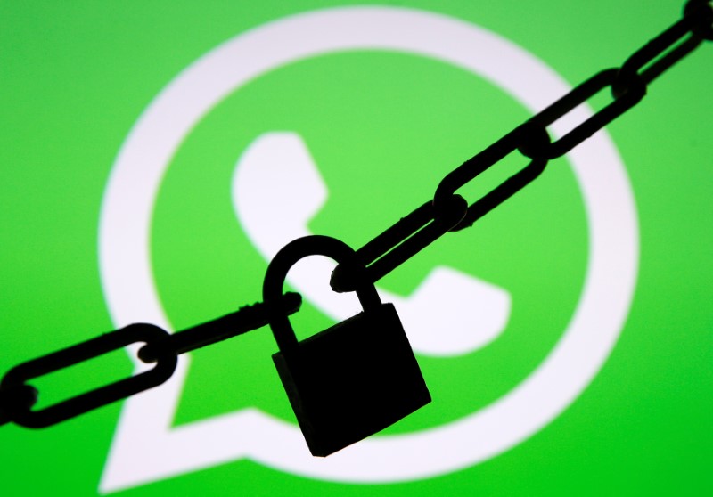 © Reuters. A photo illustration shows a chain and a padlock in front of a displayed Whatsapp logo