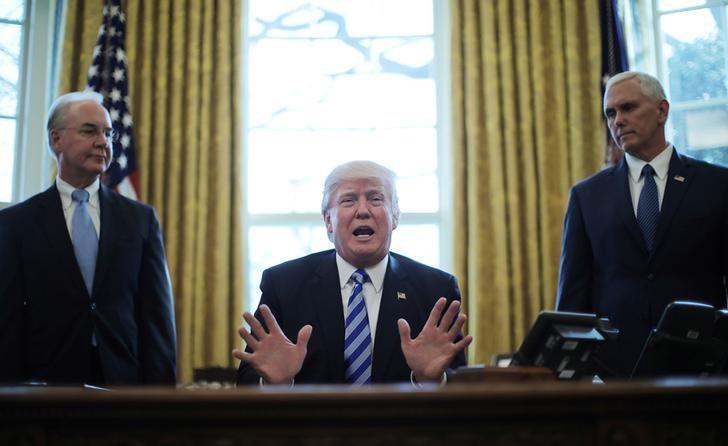 © Reuters. President Trump reacts to the AHCA health care bill being pulled as he appears with HHS Secretary Price and Vice President Pence in the Oval Office