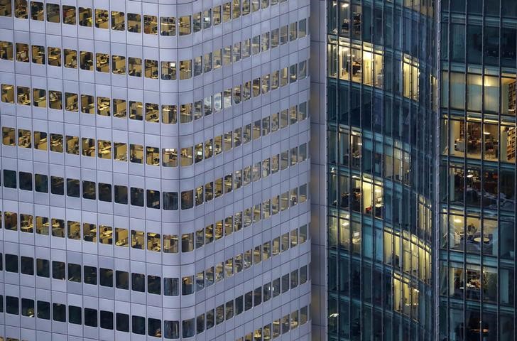© Reuters. FILE PHOTO: A busy office building is photographed from a tourist platform early evening Frankfurt