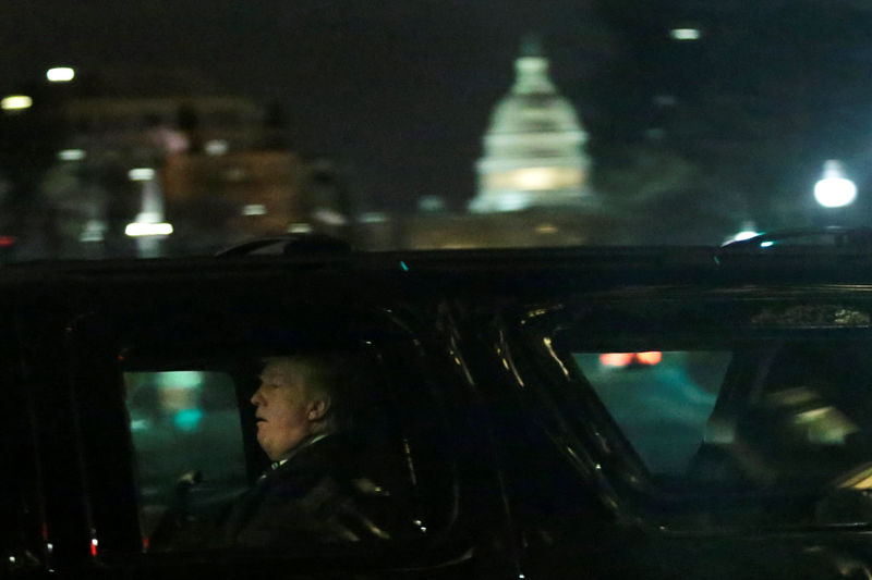 © Reuters. President Donald Trump leaves after a dinner