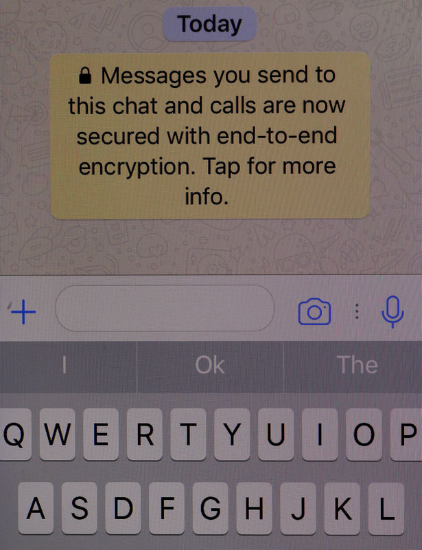 © Reuters. An encryption message is seen on the  WhatsApp application on an iPhone in Manchester , Britain.