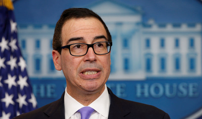 © Reuters. FILE PHOTO - Mnuchin speaks at a press briefing at the White House in Washington