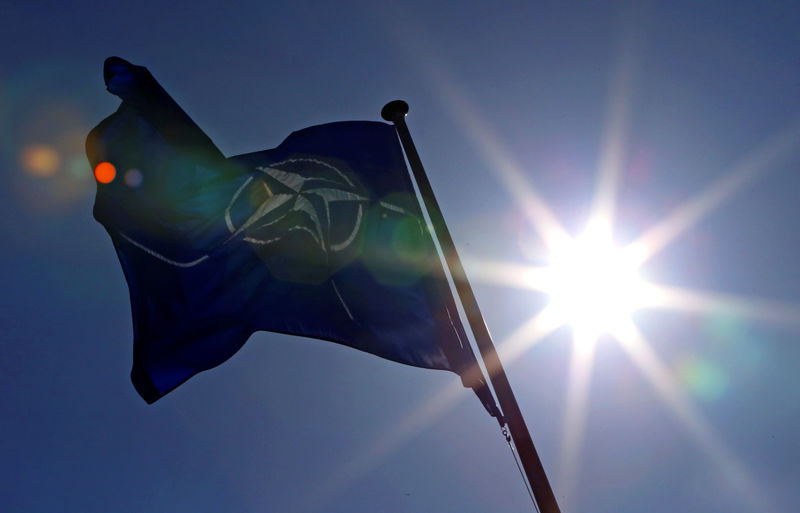© Reuters. FILE PHOTO - A NATO flag flies at the Alliance's headquarters in Brussels