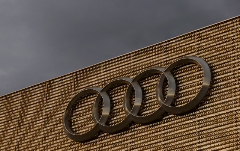 © Reuters. Logo of German car manufacturer Audi is seen at a building of a car dealer in Duebendorf