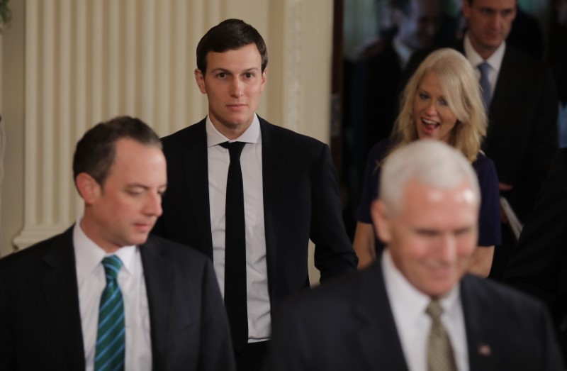 © Reuters. White House aides arrive for Trudeau-Trump  joint news conference at the White House in Washington